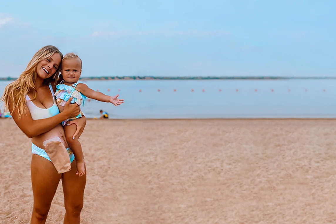 two women in swimsuits on a beach